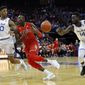 St. John&#39;s guard Bashir Ahmed (1) has the ball knocked away by Seton Hall forward Ismael Sanogo (14) in front of Seton Hall forward Desi Rodriguez (20) during the first half of an NCAA college basketball game, Sunday, Dec. 31, 2017, in Newark, N.J. (AP Photo/Adam Hunger)