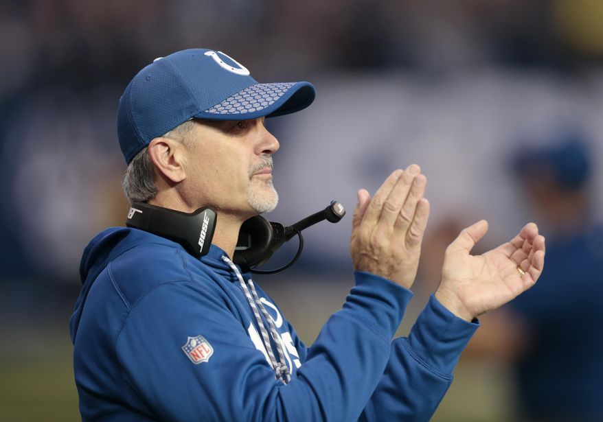 Indianapolis Colts head coach Chuck Pagano applauds during the first half of an NFL football game against the Houston Texans, Sunday, Dec. 31, 2017, in Indianapolis. (AP Photo/AJ Mast)