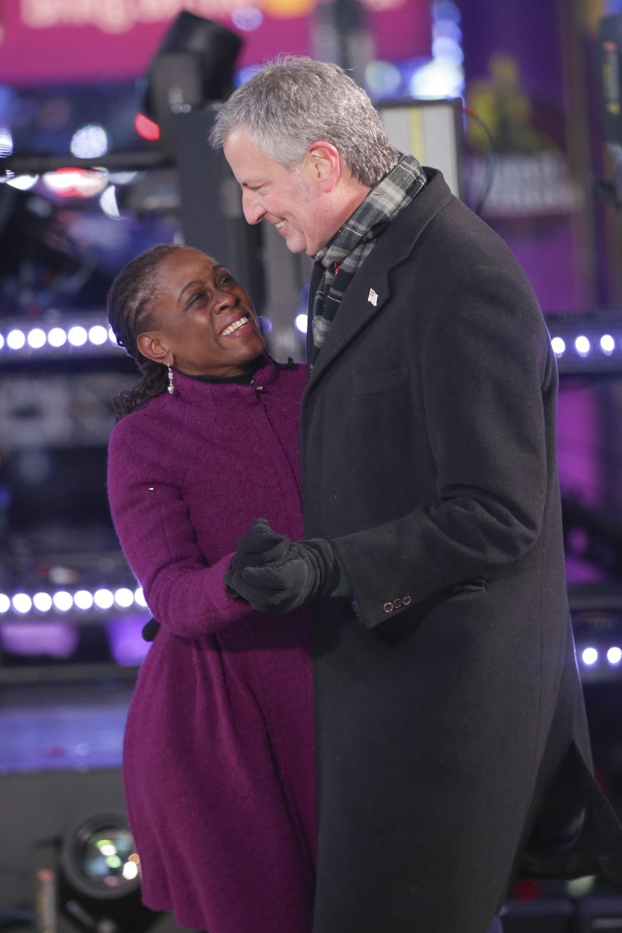 Chirlane McCray, left, and New York City Mayor Bill de Blasio dance on stage at the New Year's Eve celebration in Times Square on Sunday, Dec. 31, 2017, in New York. (Photo by Brent N. Clarke/Invision/AP)