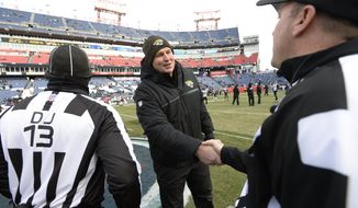 Jacksonville Jaguars head coach Doug Marrone greets officials before an NFL football game between the Jaguars and the Tennessee Titans Sunday, Dec. 31, 2017, in Nashville, Tenn. (AP Photo/Mark Zaleski)
