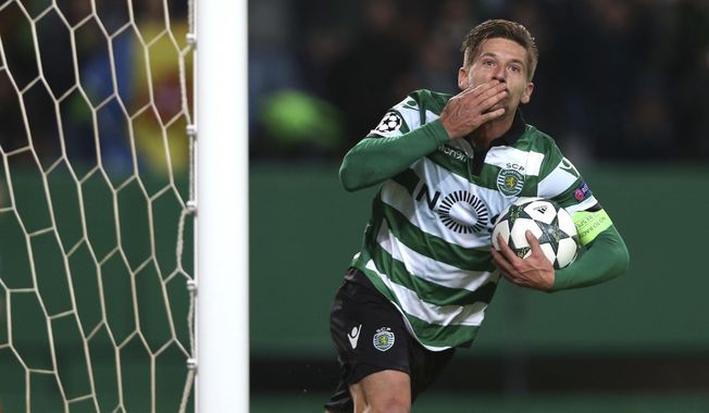 FILE - In this file photo dated Tuesday, Nov. 22, 2016, Sporting&#x27;s Adrien Silva celebrates scoring during a Champions League, Group F soccer match between Sporting CP and Real Madrid at the Alvalade stadium in Lisbon. Leicester bought Silva from Sporting Lisbon on transfer deadline day in August 2017, but did not register the deal with FIFA on time, so now Monday Jan. 1, 2018, four months after signing, Silva is finally ready to play for the English Premier League club. (AP Photo/Steven Governo, FILE)