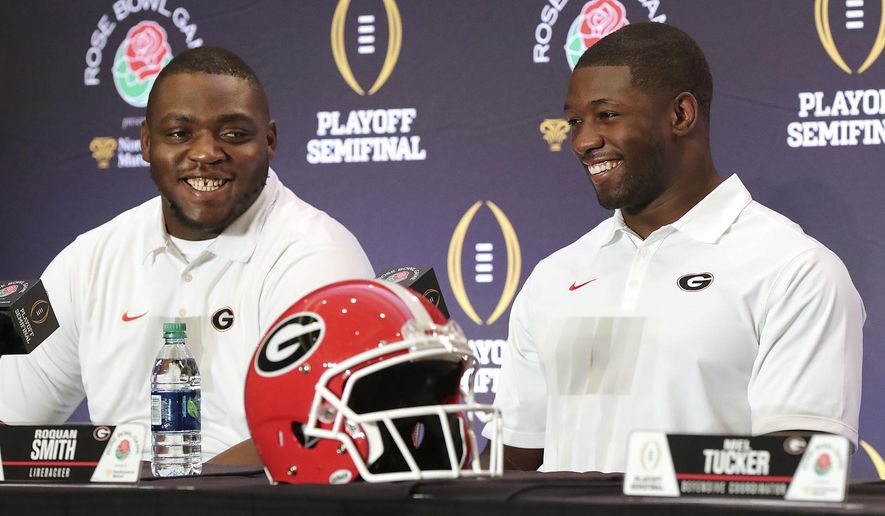 Georgia nose guard John Atkins, left, and linebacker Roquan Smith laugh during an NCAA college football news conference, Friday, Dec. 29, 2017, in Los Angeles. Oklahoma plays Georgia in the Rose Bowl on New Year's Day. (Curtis Compton/Atlanta Journal-Constitution via AP)