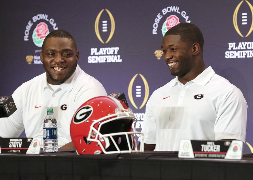 Georgia nose guard John Atkins, left, and linebacker Roquan Smith laugh during an NCAA college football news conference, Friday, Dec. 29, 2017, in Los Angeles. Oklahoma plays Georgia in the Rose Bowl on New Year's Day. (Curtis Compton/Atlanta Journal-Constitution via AP)