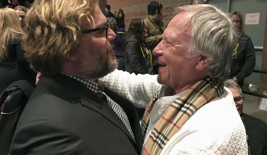 In a Jan. 22, 2017 photo, Jan Lewandowski, right, better known as Jan Lewan, embraces actor and comedian Jack Black at the premiere of “The Polka King” at the Sundance Film Festival in Park City, Utah. Lewandowski’s rise and fall is the subject of “The Polka King,” a comedy starring Black as the polka bandleader convicted of fleecing fans of millions of dollars. (John Koterba via AP)