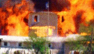 The Branch Dividian compound near Waco, Texas, burns during an FBI raid in 1993. Associated Press photo