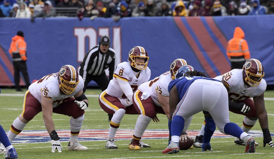 Washington Redskins quarterback Kirk Cousins (8) prepares to take the snap during the first half of an NFL football game against the New York Giants Sunday, Dec. 31, 2017, in East Rutherford, N.J. (AP Photo/Bill Kostroun)