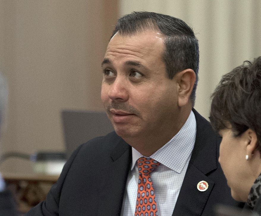 FILE - In this Aug. 26, 2016, file photo, state Sen. Tony Mendoza, D-Artesia, listens at the Capitol in Sacramento, Calif. Eyes are on the California Senate's handling of sexual misconduct allegations against one of its members as lawmakers return to Sacramento for the new year. Mendoza is resisting pressure to step aside amid an investigation into allegations of misconduct toward young women who worked for him. (AP Photo/Rich Pedroncelli, File)