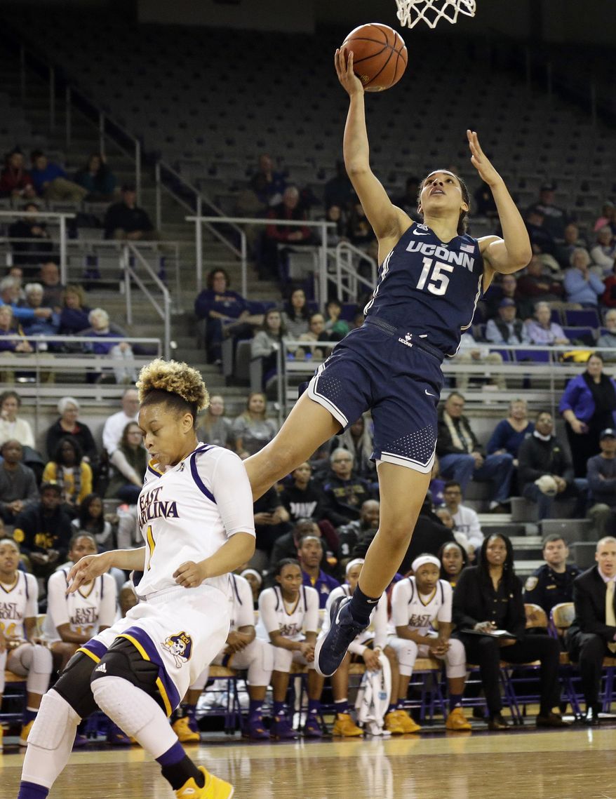 Connecticut's Gabby Williams (15) shoots over East Carolina's Alexandra Frazier during the first half of an NCAA college basketball game in Greenville, N.C., Wednesday, Jan. 3, 2018. (AP Photo/Gerry Broome)