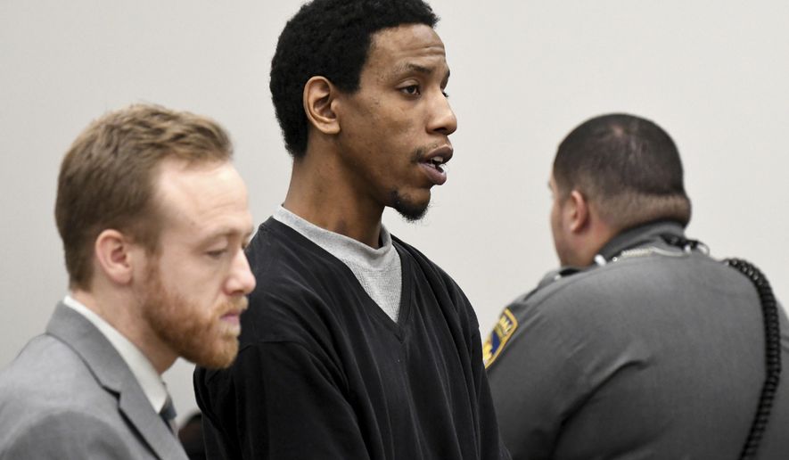James Goolsby, center, alongside public defender Russell Williams, left, pleads not guilty during his arraignment, Wednesday, Jan. 3, 2018, at Manchester Superior Court in Manchester, Conn. Police charged the 28-year-old with murder in the death of 36-year-old Norris Jackson, who was shot at the Bonchon Chicken restaurant in Manchester just before noon last Saturday. He is being held in lieu of a $1 million bond. Goolsby girlfriend, 23-year-old Leanne Robitaille, was charged with hindering prosecution. She was in custody on a bond of $100,000. (Jim Michaud/Journal Inquirer via AP, Pool)