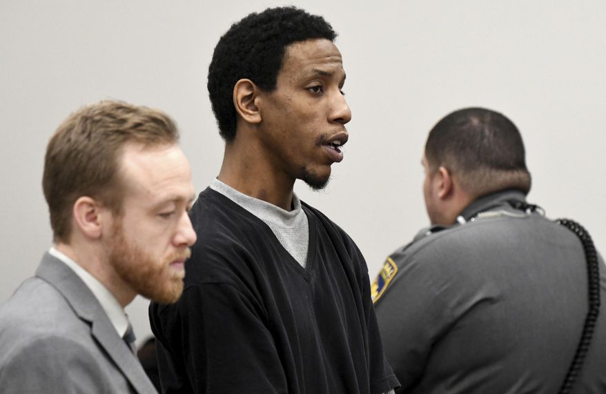 James Goolsby, center, alongside public defender Russell Williams, left, pleads not guilty during his arraignment, Wednesday, Jan. 3, 2018, at Manchester Superior Court in Manchester, Conn. Police charged the 28-year-old with murder in the death of 36-year-old Norris Jackson, who was shot at the Bonchon Chicken restaurant in Manchester just before noon last Saturday. He is being held in lieu of a $1 million bond. Goolsby girlfriend, 23-year-old Leanne Robitaille, was charged with hindering prosecution. She was in custody on a bond of $100,000. (Jim Michaud/Journal Inquirer via AP, Pool)