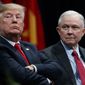  In this Dec. 15, 2017, file photo, President Donald Trump sits with Attorney General Jeff Sessions during the FBI National Academy graduation ceremony in Quantico, Va. (AP Photo/Evan Vucci, File)