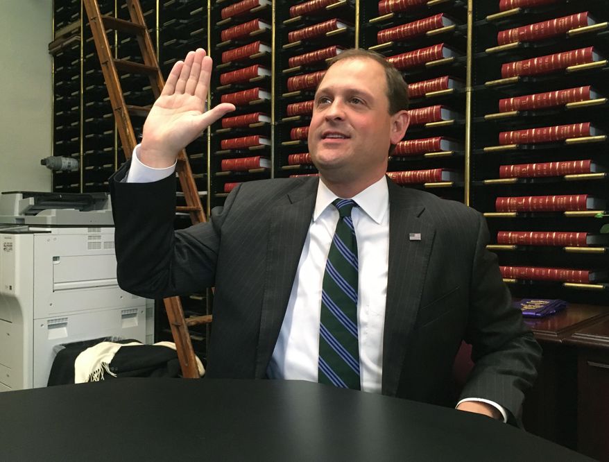Republican U.S. Rep. Andy Barr swears to the accuracy of his paperwork as he filed for re-election on Thursday, Jan. 4, 2018, in Frankfort, Ky. Barr is seeking a fourth term in Kentucky’s 6th Congressional District. (AP Photo/Adam Beam)