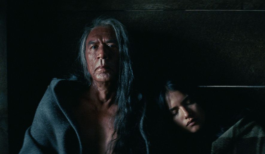 This image released by Entertainment Studios Motion Pictures shows Wes Studi, left, and Q'orianka Kilcher in a scene from "Hostiles." (Entertainment Studios Motion Pictures via AP)