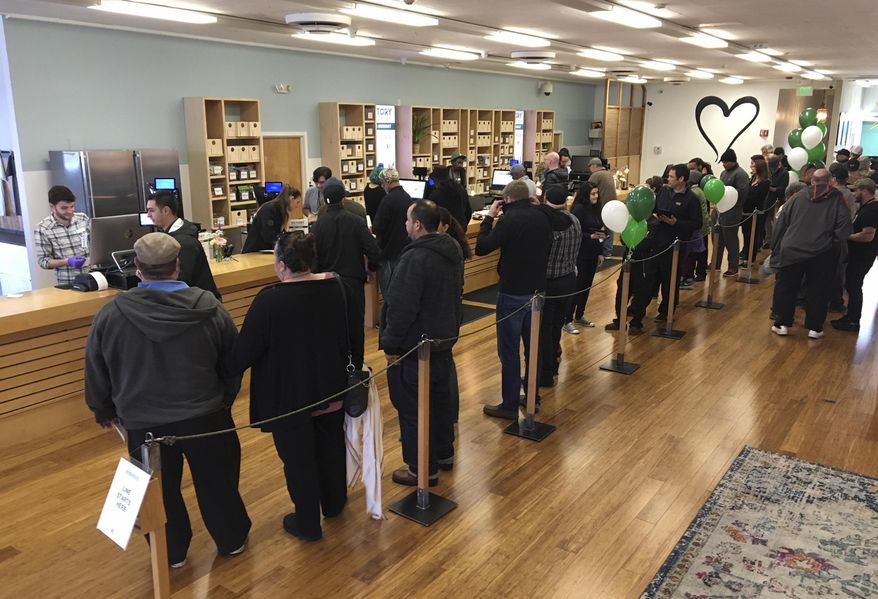 Customers line up inside the Harborside cannabis dispensary Thursday, Jan. 4, 2018, in Oakland, Calif. Attorney General Jeff Sessions has rescinded an Obama-era policy that paved the way for legalized marijuana to flourish in states across the country, creating new confusion about enforcement and use just three days after a new legalization law went into effect in California. (AP Photo/Terry Chea)