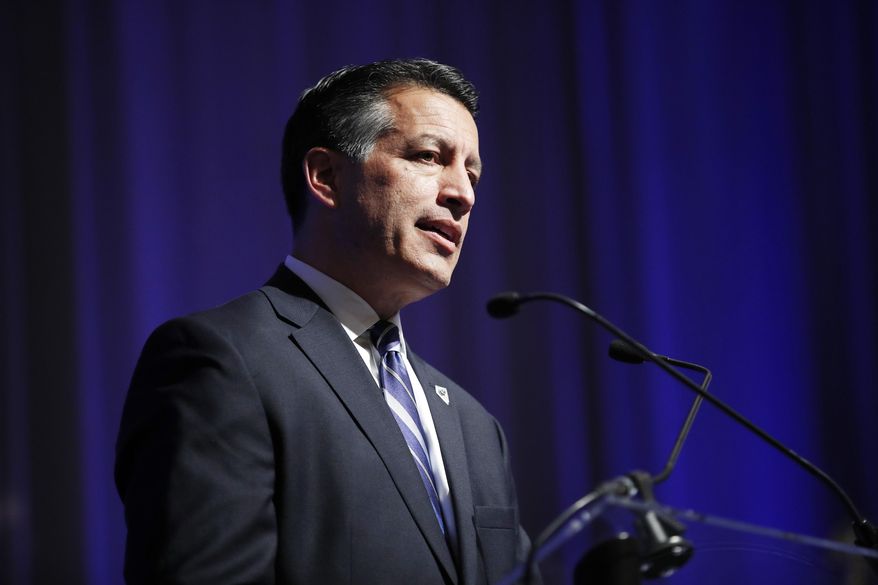 File - In this Dec. 5, 2017 file photo, Nevada Gov. Brian Sandoval speaks at the Governor's Global Tourism Summit in Las Vegas. Millions of dollars and thousands of jobs could go up in smoke if federal authorities crack down on marijuana sales and possession in the state where recreational pot became legal last July, some Nevada state and federal lawmakers said Thursday, Jan. 4, 2018. Sandoval, a moderate Republican who talked with U.S. Attorney General Jeff Sessions about marijuana policy last April, said Nevada's marijuana industry has become a model for other states while working within the guidelines of federal policies. (AP Photo/John Locher, File)