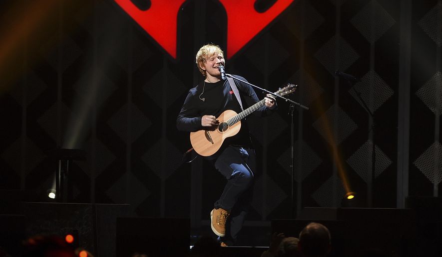 FILE - In this Dec. 8, 2017, file photo, singer-songwriter Ed Sheeran performs at Z100's iHeartRadio Jingle Ball at Madison Square Garden, in New York. Sheeran’s album “Divide” was the most popular album of 2017, helping the music industry enjoy a growth spurt during the year, according to Nielsen Music. (Photo by Evan Agostini/Invision/AP, File)