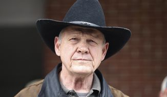In this Dec. 12, 2017, file photo, U.S. Senate candidate Roy Moore speaks to the media after he rode in on a horse to vote in Gallant, Ala. (AP Photo/Brynn Anderson, File)