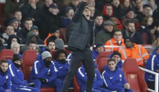 Chelsea&#39;s manager Antonio Conte shouts to his team during the English Premier League soccer match between Arsenal and Chelsea at Emirates stadium in London, Wednesday, Jan. 3, 2018. (AP Photo/Frank Augstein)