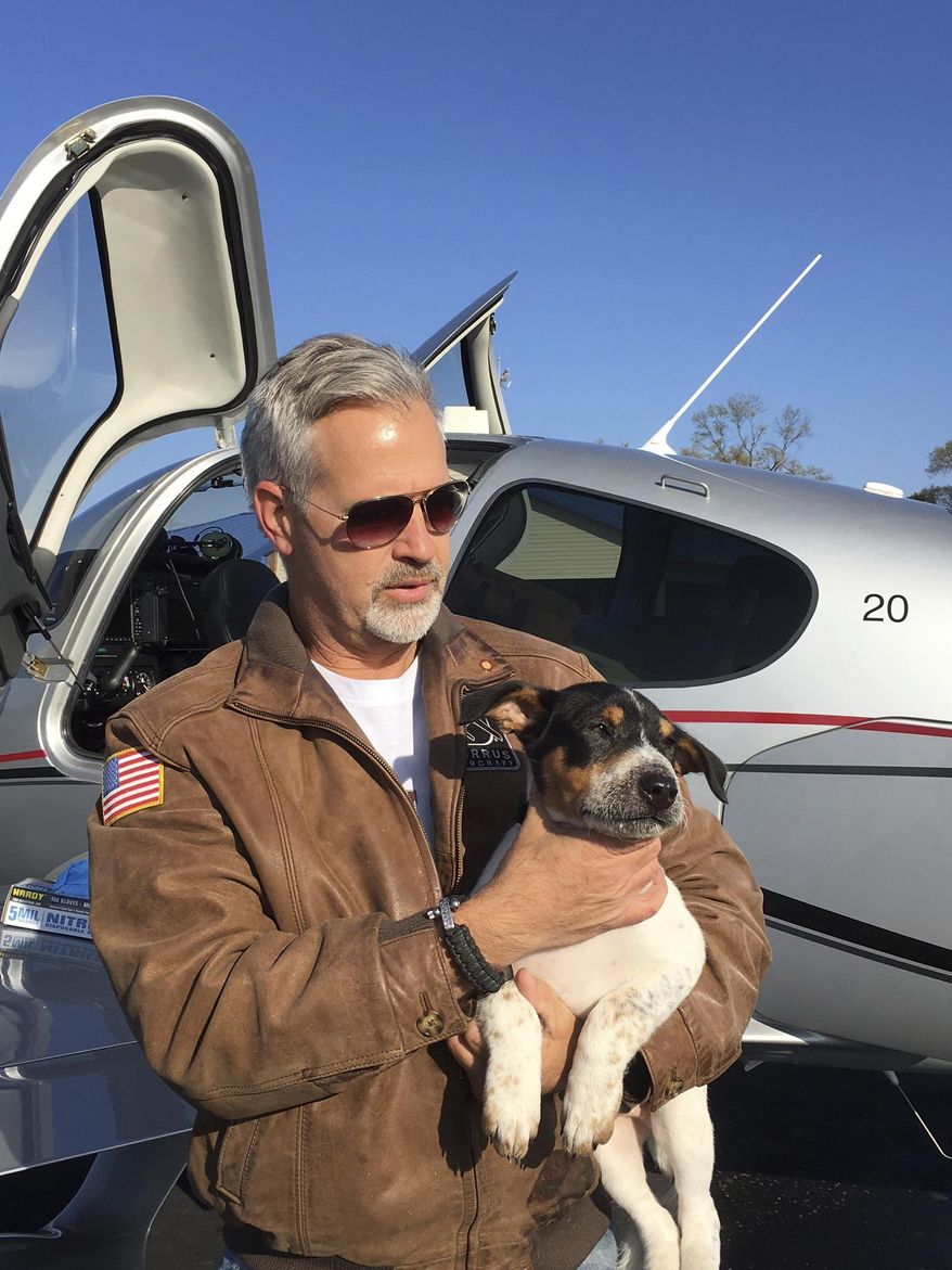 In this undated photo provided by Rachelle Hurd, Dr. Bill Kinsinger is pictured at the Russellville Arkansas airport in Little Rock, Arkansas. Kinsinger who volunteering for a dog rescue operation failed to land his small plane at an airport in Central Texas as planned and was later tracked by fighter jets flying over the Gulf of Mexico appeared unresponsive and may have been suffering from a lack of oxygen, officials said Thursday, Jan. 4, 2018. (Rachelle Hurd via AP)
