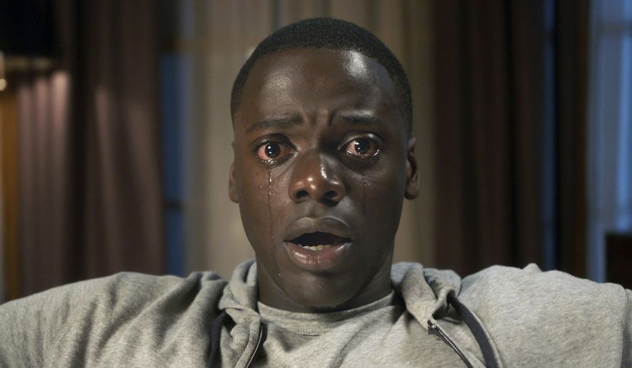 This image released by Universal Pictures shows Daniel Kaluuya in a scene from, "Get Out." The Producers Guild of America says it has chosen the horror film and producer-screenwriter-director Ava DuVernay for special honors. “Get Out,” co-produced by Jordan Peele, was picked for the guild's Stanley Kramer Award. It’s also among 11 nominees for the top film category. The guild will hold its annual ceremony Jan. 20, 2018, in Los Angeles. (Universal Pictures via AP)