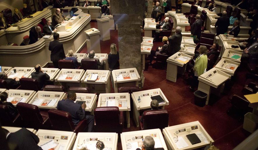 FILE - In this March 3, 2015 file photo, Alabama representatives prepare for the opening session in the house of representatives chambers at the State House in Montgomery, Ala. Alabama lawmakers return to Montgomery on Tuesday, Jan. 9, 2018, to begin the 2018 legislative session that comes at the start of an election year. The session is expected to dominated by two major budgetary issues: Prisons and Children's Health Insurance Program. (AP Photo/Brynn Anderson, File)