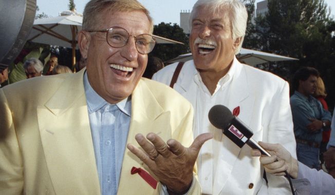 In this Aug. 25, 1992, file photo, Jerry Van Dyke, left, and his brother, Dick, laugh during a party in Los Angeles. Jerry Van Dyke, &quot;Coach&quot; star and younger brother of comedian Dick Van Dyke, died in Arkansas at 86 on Jan. 5, 2018. His wife, Shirley Ann Jones, was by his side. (AP Photo/Chris Martinez, File)