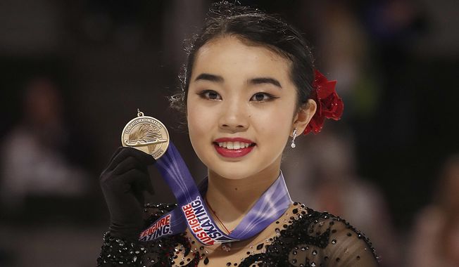 Karen Chen poses after finishing third at the women&#x27;s free skate event at the U.S. Figure Skating Championships in San Jose, Calif., Friday, Jan. 5, 2018. (AP Photo/Tony Avelar) **FILE**
