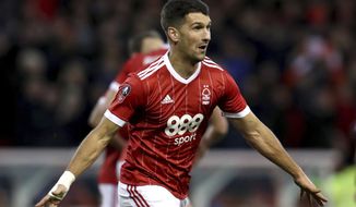 Nottingham Forest&#x27;s Eric Lichaj celebrates scoring his side&#x27;s first goal of the game during the English FA Cup, Third Round soccer match between Nottingham Forest and Arsenal at the City Ground, Nottingham, England, Sunday, Jan. 7, 2018. (Mike Egerton/PA via AP)
