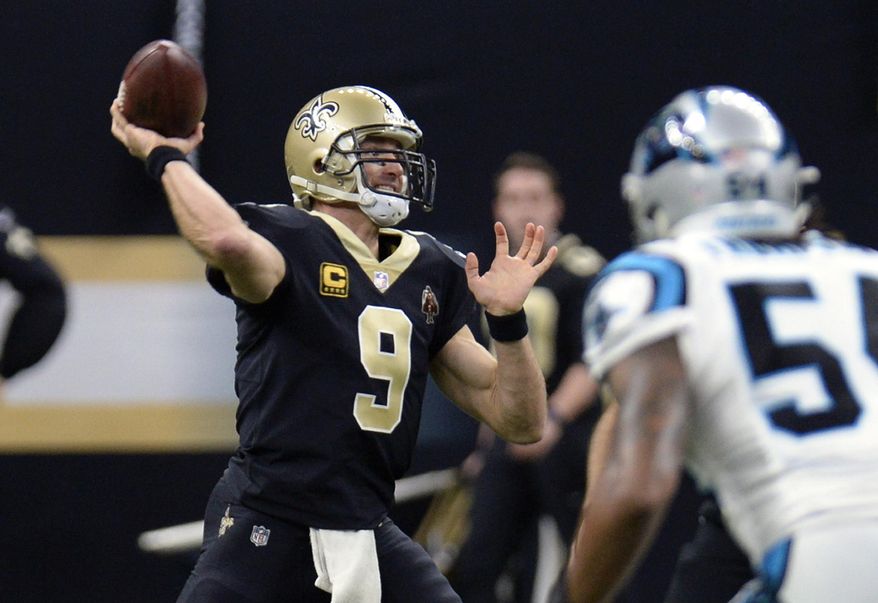 New Orleans Saints quarterback Drew Brees (9) passes in the first half of an NFL football game against the Carolina Panthers in New Orleans, Sunday, Jan. 7, 2018. (AP Photo/Bill Feig)