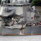 Damaged part of USS Fitzgerald is seen at the U.S. Naval base in Yokosuka, southwest of Tokyo Sunday, June 18, 2017.  Navy divers found a number of sailors&#x27; bodies Sunday aboard the stricken USS Fitzgerald that collided with a container ship in the busy sea off Japan, but a spokeswoman said not all seven missing had been accounted for. (AP Photo/Eugene Hoshiko)