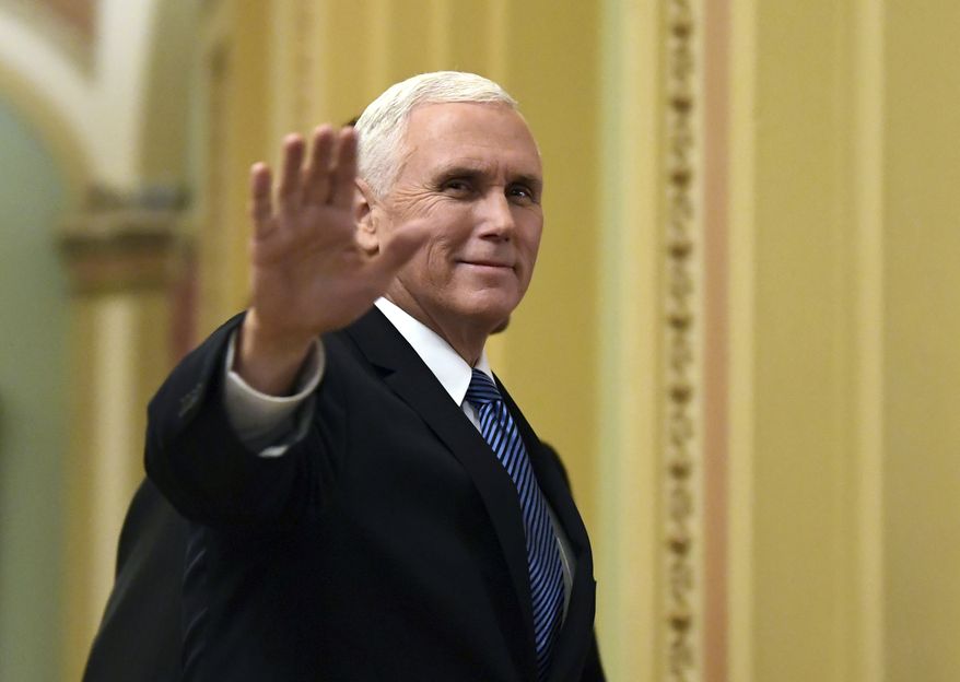 FILE - In this Jan. 3, 2018, file photo, Vice President Mike Pence waves as he walks on Capitol Hill in Washington. (AP Photo/Susan Walsh, File)