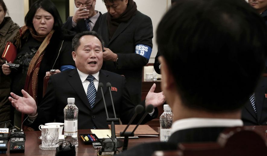 Head of North Korean delegation Ri Son Gwon speaks to South Korean Unification Cho Myoung-gyon, right, during their meeting at the Panmunjom in the Demilitarized Zone in Paju, South Korea, Tuesday, Jan. 9, 2018. Senior officials from the rival Koreas said Tuesday they would try to achieve a breakthrough in their long-strained ties as they sat for rare talks at the border to discuss how to cooperate in next month's Winter Olympics in the South and other issues. (Korea Pool via AP)