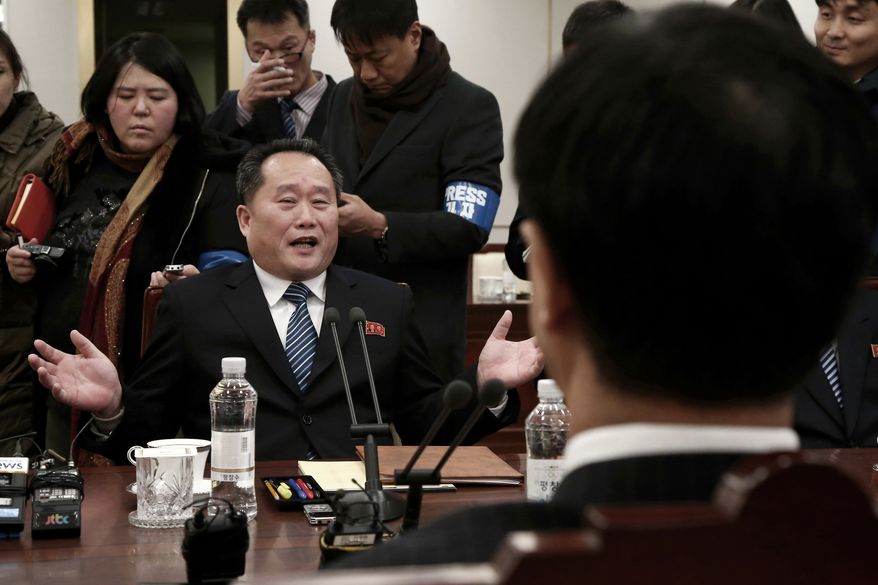 Head of North Korean delegation Ri Son Gwon speaks to South Korean Unification Cho Myoung-gyon, right, during their meeting at the Panmunjom in the Demilitarized Zone in Paju, South Korea, Tuesday, Jan. 9, 2018. Senior officials from the rival Koreas said Tuesday they would try to achieve a breakthrough in their long-strained ties as they sat for rare talks at the border to discuss how to cooperate in next month's Winter Olympics in the South and other issues. (Korea Pool via AP)