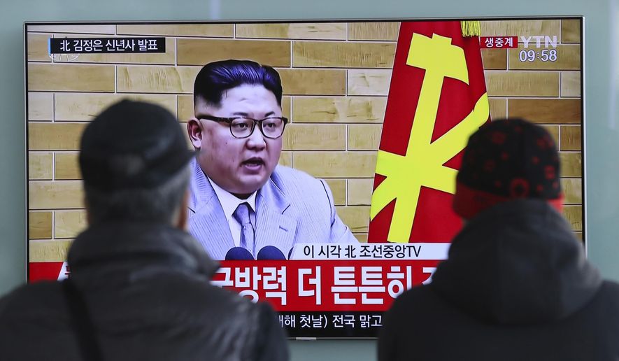 FILE - In this Jan. 1, 2018, file photo, South Koreans watch a TV news program showing North Korean leader Kim Jong Un&#x27;s New Year&#x27;s speech, at the Seoul Railway Station in Seoul, South Korea. On Jan. 1, 2018, Kim said in his New Year’s address that he is willing to send a delegation to the Pyeongchang Olympics. (AP Photo/Lee Jin-man, File)