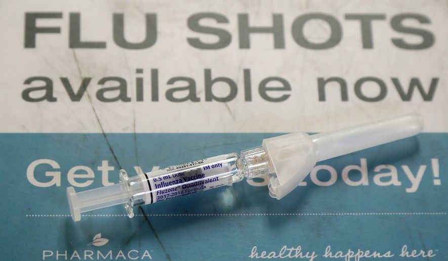 A Fluzone influenza vaccine is shown at Pharmaca Integrative Pharmacy in San Francisco, Tuesday, Jan. 9, 2018. Flu-related deaths in California are higher than usual so far this season and most victims were not vaccinated, state health officials said Tuesday in urging residents to get flu shots. (AP Photo/Jeff Chiu)