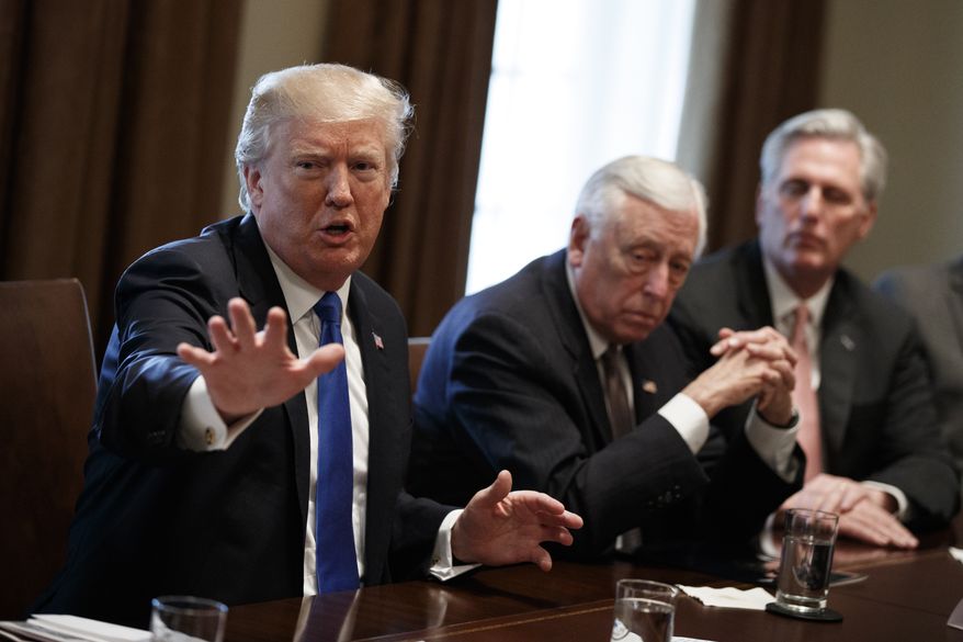 President Donald Trump speaks during a meeting with lawmakers on immigration policy in the Cabinet Room of the White House, Tuesday, Jan. 9, 2018, in Washington. From left, Trump, Rep. Steny Hoyer, D-Md., and Rep. Kevin McCarthy, R-Calif. (AP Photo/Evan Vucci)