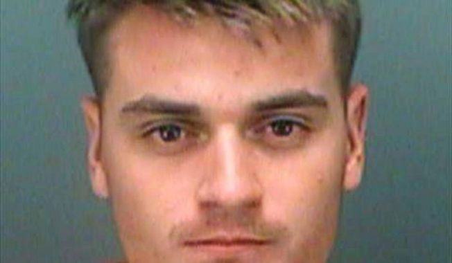 File - This June 7, 2017 file photo provided by the Pinellas County Sheriff&#x27;s Office shows Brandon Russell. The neo-Nazi group leader who stockpiled explosive material in the Florida apartment where a friend killed two roommates was sentenced to five years in federal prison. The sentence, handed down Tuesday, Jan. 9, 2018, in a Tampa federal court against Russell, was less than the 11 years sought by prosecutors. (Pinellas County Sheriff&#x27;s Office via AP, File)