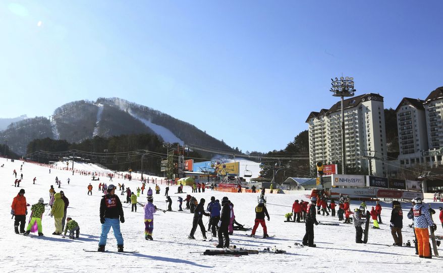In this Dec. 19, 2017, photo, people take to the slopes at Yongpyong Resort in Pyeongchang, South Korea. South Korea is one of the safest places in the world to live and visit. The Pyeongchang Olympics are coming to a remote, ruggedly beautiful part of South Korea known for icy wind, towering granite mountains and a tough, proud population waiting to welcome foreign hordes. (AP Photo/Ahn Young-joon)