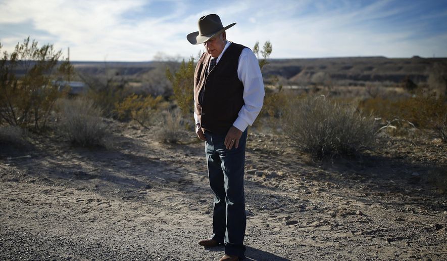 FILE - In this Jan. 27, 2016, file photo, rancher Cliven Bundy stands along the road near his ranch in Bunkerville, Nev. The Nevada rancher freed from federal custody this week after his prosecution on conspiracy and assault on government officer charges collapsed is casting himself as having fought the law and winning. (AP Photo/John Locher, File)