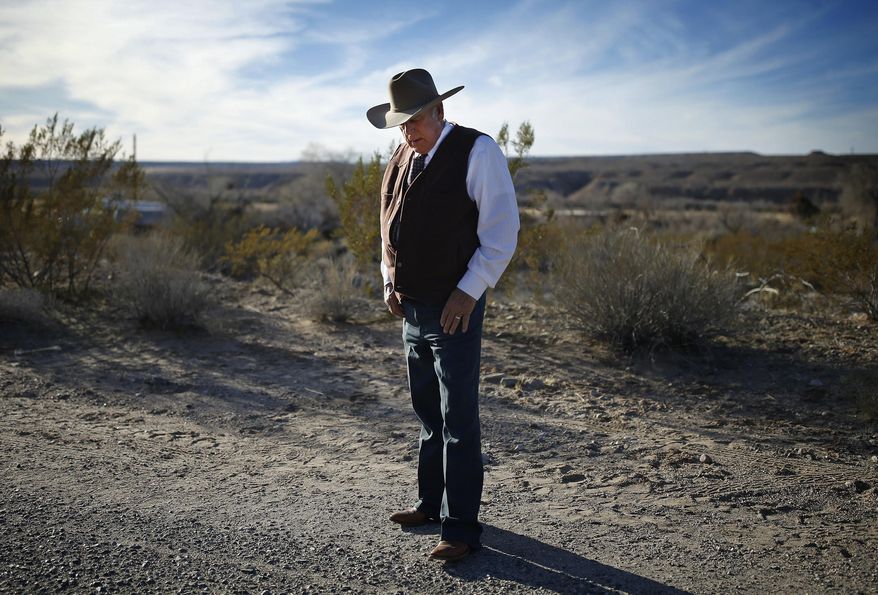 FILE - In this Jan. 27, 2016, file photo, rancher Cliven Bundy stands along the road near his ranch in Bunkerville, Nev. The Nevada rancher freed from federal custody this week after his prosecution on conspiracy and assault on government officer charges collapsed is casting himself as having fought the law and winning. (AP Photo/John Locher, File)
