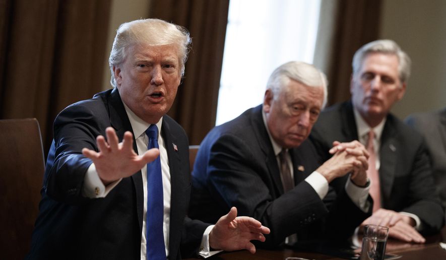 President Donald Trump speaks during a meeting with lawmakers on immigration policy in the Cabinet Room of the White House, Tuesday, Jan. 9, 2018, in Washington. From left, Trump, Rep. Steny Hoyer, D-Md., and Rep. Kevin McCarthy, R-Calif. (AP Photo/Evan Vucci)