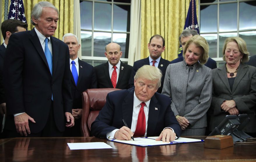President Donald Trump signs into law the bipartisan Interdict Act to curtail opioids trafficking, during a ceremony in the Oval Office of the White House in Washington, Wednesday, Jan. 10, 2018. The law will provide Customs and Border Protection the latest in chemical screening devices and scientific support to detect and intercept fentanyl and other synthetic opioids at the border. (AP Photo/Manuel Balce Ceneta)
