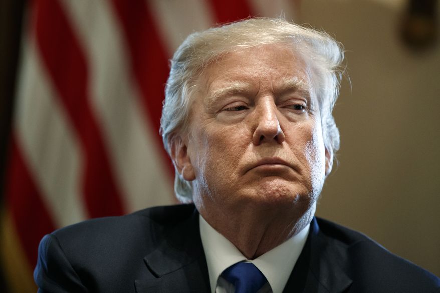 President Donald Trump listens during a meeting with lawmakers on immigration policy in the Cabinet Room of the White House, Tuesday, Jan. 9, 2018, in Washington. Trump is lashing out at Sen. Dianne Feinstein for releasing the transcript of an interview with the co-founder of a political opposition firm that commissioned a dossier of allegations about Trump's presidential campaign and Russia. (AP Photo/Evan Vucci)