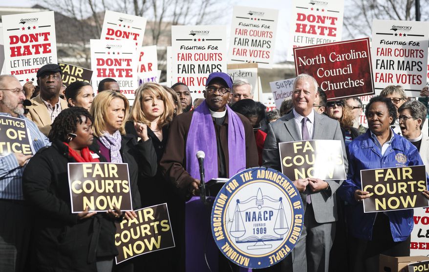 North Carolina NAACP President, the Rev. Dr. T. Anthony Spearman, speaks to a large crowd Wednesday, Jan. 10, 2018, about a federal court&#x27;s decision on Tuesday to strike down North Carolina&#x27;s congressional map in Raleigh, N.C. Tuesday&#x27;s &amp;quot;decision is a mammoth decision,&amp;quot; said Spearman. (Julia Wall/The News &amp;amp; Observer via AP)