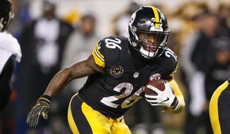 In this Sunday, Dec. 10, 2017, file photo, Pittsburgh Steelers running back Le&#x27;Veon Bell (26) plays in an NFL football game against the Baltimore Ravens in Pittsburgh. The running back is fresh heading into Sunday&#x27;s playoff game against Jacksonville. Bell only had 15 carries in the teams&#x27; first meeting this season. (AP Photo/Keith Srakocic) ** FILE **