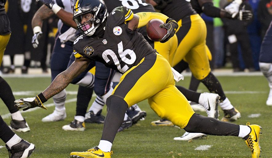 FILE - This file photo from Dec. 17, 2017, Pittsburgh Steelers running back Le&#39;Veon Bell (26) as he runs the ball against the New England Patriots during the first half of an NFL football game in Pittsburgh. The running back is fresh heading into Sunday&#39;s playoff game against Jacksonville. Bell only had 15 carries in the teams&#39; first meeting this season. (AP Photo/Don Wright, FILE)