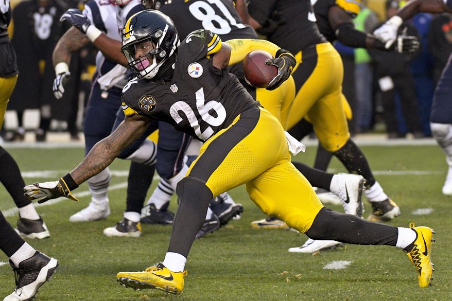 FILE - This file photo from Dec. 17, 2017, Pittsburgh Steelers running back Le&#39;Veon Bell (26) as he runs the ball against the New England Patriots during the first half of an NFL football game in Pittsburgh. The running back is fresh heading into Sunday&#39;s playoff game against Jacksonville. Bell only had 15 carries in the teams&#39; first meeting this season. (AP Photo/Don Wright, FILE)
