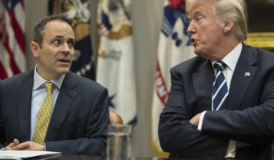 President Donald Trump, right, and Kentucky Governor Matt Bevin, left, talk during a prison reform roundtable in the Roosevelt Room of the Washington, Thursday, Jan. 11, 2018. (AP Photo/Carolyn Kaster)