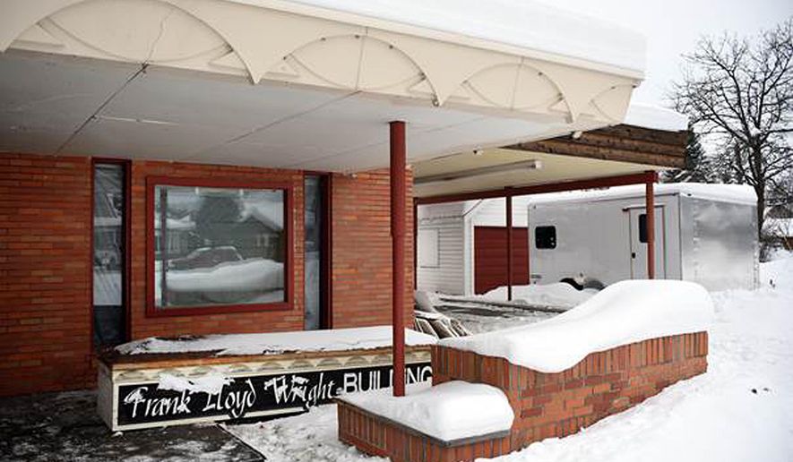 This recent but undated photo shows demolition of the Frank Lloyd Wright Building underway in Whitefish, Mont. Currently the work is being done on the inside, though the sign that stood on the exterior has been taken down. The Frank Lloyd Wright Building Conservancy is trying to prevent the commercial building in northwestern Montana designed by the famed architect from being demolished. The Chicago-based conservancy is trying to find someone to pay $1.7 million for the former medical center, designed by Wright in 1958, a year before he died. (Brenda Ahearn/The Daily Inter Lake via AP)