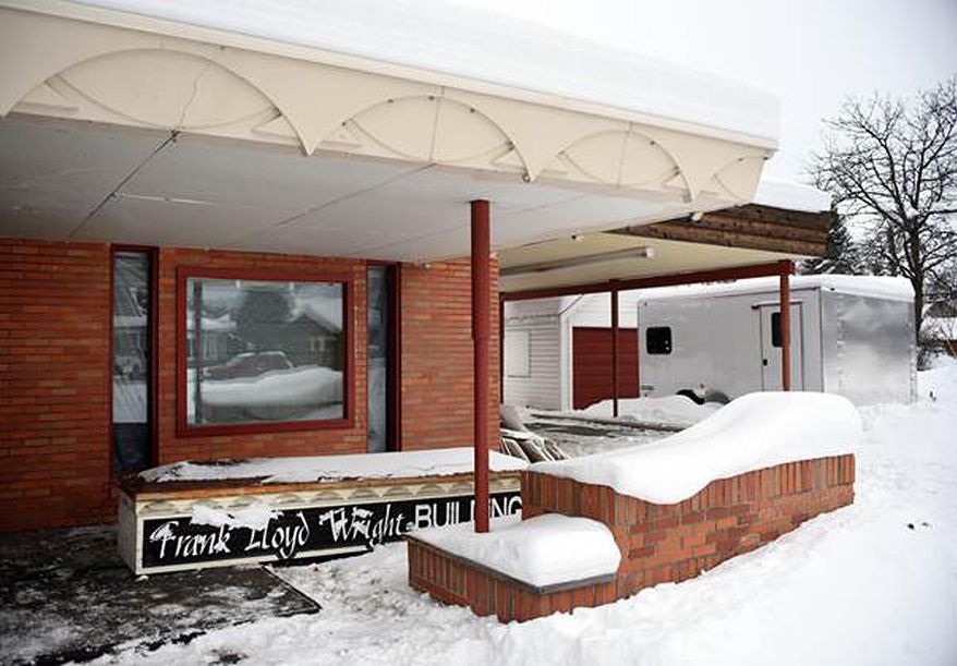 This recent but undated photo shows demolition of the Frank Lloyd Wright Building underway in Whitefish, Mont. Currently the work is being done on the inside, though the sign that stood on the exterior has been taken down. The Frank Lloyd Wright Building Conservancy is trying to prevent the commercial building in northwestern Montana designed by the famed architect from being demolished. The Chicago-based conservancy is trying to find someone to pay $1.7 million for the former medical center, designed by Wright in 1958, a year before he died. (Brenda Ahearn/The Daily Inter Lake via AP)